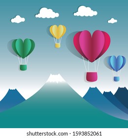 The valentine festival by pink yellow green and blue heart balloon paper. On sky top on hills. Vector File.