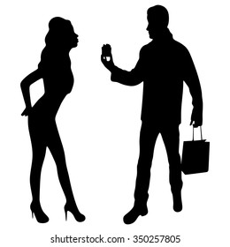 Valentine Gift. Happy Young Couple with Valentine's Day Present isolated on a White background. Happy Man giving a gift to his Girlfriend. Holiday