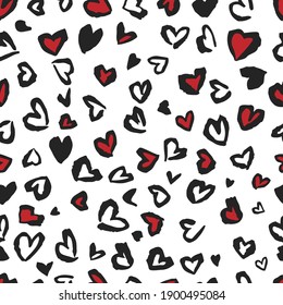Valentine Leopard or cheetah seamless pattern. Trendy animal print. Spotted red and dark gray hearts imitate jaguar skin. Vector background for fabric, textile, wallpaper, wrapping paper, etc.