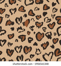 Valentine Leopard or cheetah seamless pattern. Trendy animal print. Spotted hearts imitate jaguar fur. Vector background for wallpaper, textile, fabric, wrapping paper, etc.