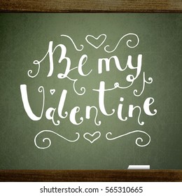 Valentine's background with the words of Be My Valentine, handwritten on blackboard with chalk.