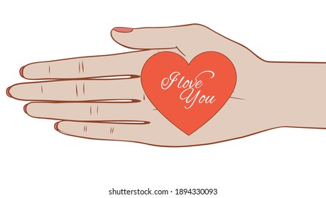 Valentine's card in female hand. woman's palm holding a valentine card in the shape of a heart.