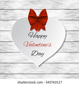 Valentine's day abstract background with cut paper heart 
With bow on white
wood background. Vector illustration