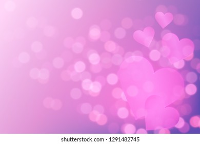 Valentine's day abstract background with pink glowing bokeh lights