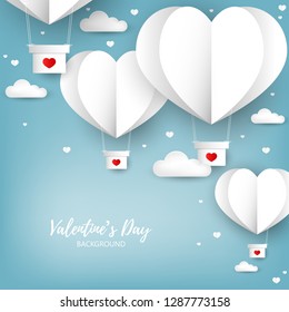 Valentine's day background of a group of heart shape hot air balloons with red heart pattern floating on blue sky with clouds, many tiny hearts and your copy space. Concept of love in paper art style.