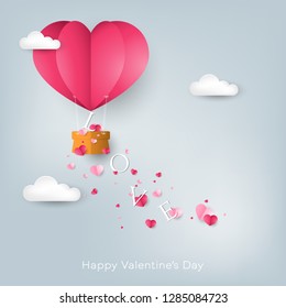 Valentine's day background of LOVE text falling from heart shape hot air balloon with many tiny pink hearts on the sky with clouds and Happy Valentine's Day text. Concept of love in paper art style.