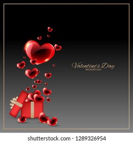 Valentine's day background of many red hearts floating from red gift box with gold ribbons on black background with gold frame and your copy space. Love concept for background, advertising and banner.