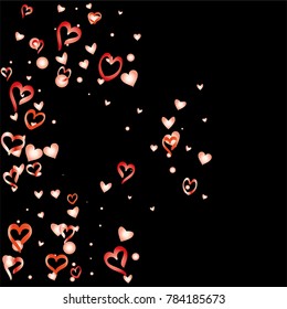 Valentines day background with random hand drawn falling red hearts isolated on black.