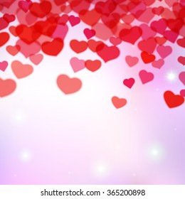 Valentines Day background with scattered blurred hearts