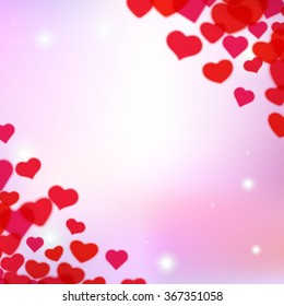 Valentines Day background with scattered blurred hearts