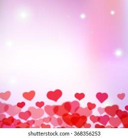 Valentines Day background with scattered blurred hearts