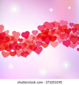 Valentines Day background with scattered blurred hearts