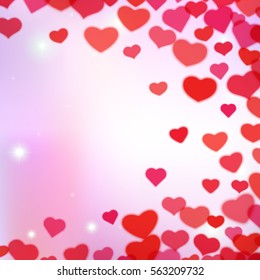 Valentines Day background with scattered blurred hearts