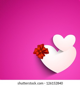 Valentines Day background with sticky, label or tag in heart shape on pink background.