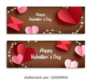 Valentine's day banner with heart on wooden background and typography of happy valentine's day text.