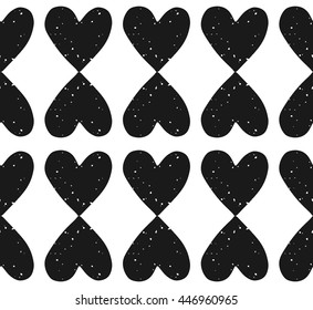 Valentine's Day block print seamless pattern with grunge textured black heart shaped ornament on white background