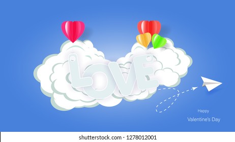 Valentine's Day card. Abstract background With the words of love that float in the air, colorful hearts and bright blue skies. Paper cut.