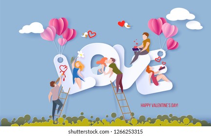 Valentines day card with couple sitting on big letters LOVE and sending red hearts with their smartphones, kissing and painting on blue sky background. Vector paper art illustration. Paper cut style.