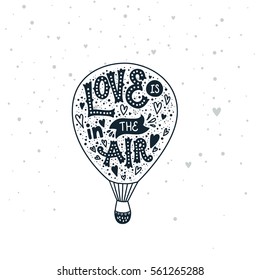 Valentines day card with handdrawn letters and aerostat. Love is in the air. Vector typography poster, romantic quote