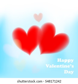 Valentines day card with soft red hearts on blue background.