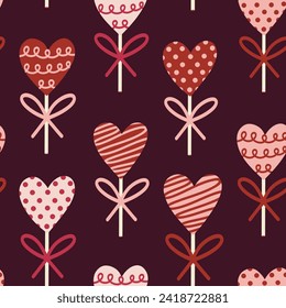 Valentine's Day Chocolate Heart Lollipops on Maroon Seamless Pattern Design