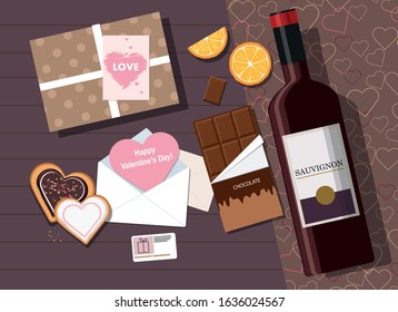 Valentine's day composition. Valentine card, cookies, gift box and wine. Top view.