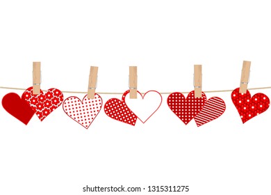 Valentines day concept with hearts and clothes pegs on rope 