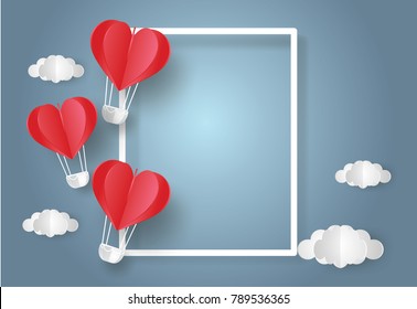 Valentine's day concept.Balloon  in a heart shape floating with text in white border on blue sky background.Paper and craft art