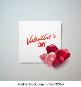 Valentines Day. Couple of woven red and pink hearts made of textile ribbon on the paper banner with vintage lettering. Vector holiday illustration. Love concept. Greeting card or festive poster design