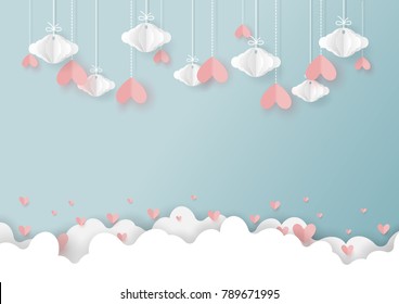 Valentine's day greeting card and love concept of paper art style.Origami hanging hearts and cloud on blue background.Vector illustration.