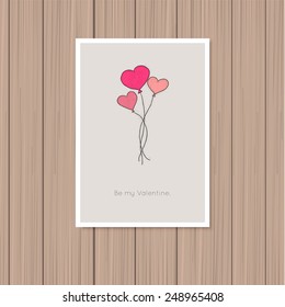 Valentine's day greeting card on a wooden background