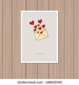 Valentine's day greeting card on a wooden background