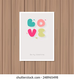 Valentine's day greeting card on a wooden background