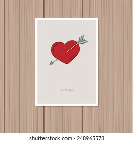Valentine's day greeting card on a wooden background
