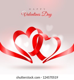 Valentines Day greeting card - ribbon in the shape of two hearts