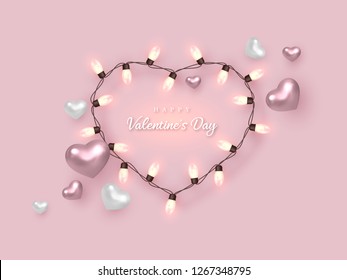 Valentines day holiday banner. 3d metallic glossy hearts with light bulbs and greeting text on soft pink background. Vector illustration.