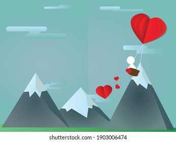 valentines day. people in love on ballon fly over moutain with heart