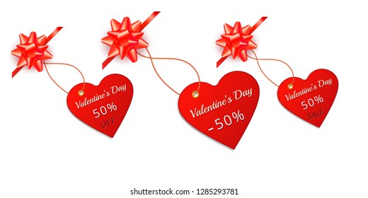 Valentines day red sale tag and label in form of heart with gift bow and ribbon isolated on white background