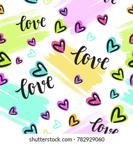 Valentine's Day Romantic seamless pattern with brush calligraphy style lettering and hearts.
