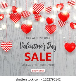 Valentine's Day sale background. Vector illustration with red paper garlands and glowing garlands with hearts on wooden texture. Holiday greeting banner. Promo seasonal offer.