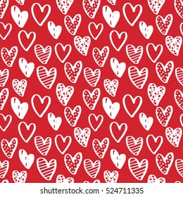 Valentine's day seamless pattern with cute doodle hearts. White ink on red isolated background. Vector ornamental design for textile and wrapping paper.