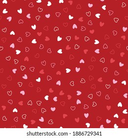 Valentines day seamless pattern with hand drawn hearts of different colors on a red background in vector. Template for postcards, wallpaper, textile, scrapbooking and wrapping paper.