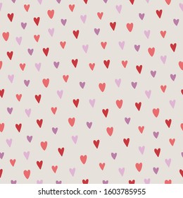 Valentine's Day seamless pattern with red and violet hearts on beige background. Scandinavian style. Perfect for greeting cards, wallpaper, gift paper, wedding decorations