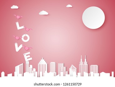 Valentines day vector background with pink heart shape and wing, love word  over cloud and cityscape concept, paper cut design