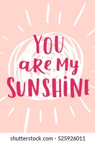 Valentine's Day vector greeting card. Hand written lettering with quote You are my sunshine and doodle sun on rose isolated background. Cute label design.