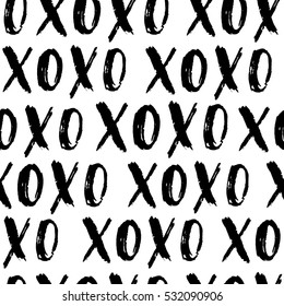 Valentine's Day vector seamless pattern. Hand written doodle XO XO on white isolated background. Cute pattern label design.