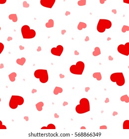 Valentine's day vector seamless pattern with red and pink hearts on a white background.