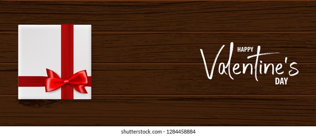 Valentines Day wood 3d vector background. Wooden texture, gift box with red satin ribbon bow. Top view horizontal realistic design. Valentine's Day red bow gift card.