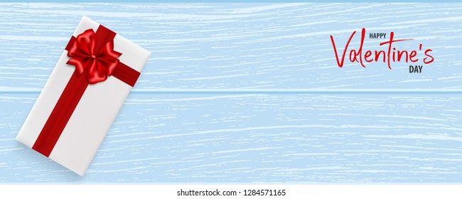 Valentines Day wood 3d vector background. Wooden texture, gift box with red satin ribbon bow. Top view horizontal realistic design. Valentine's Day red bow gift card.