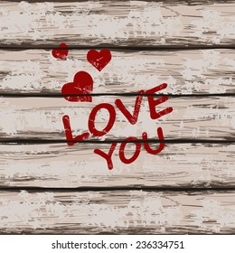 Valentine's greeting card. Illustration with text love you and hearts on a retro wooden boards background 
